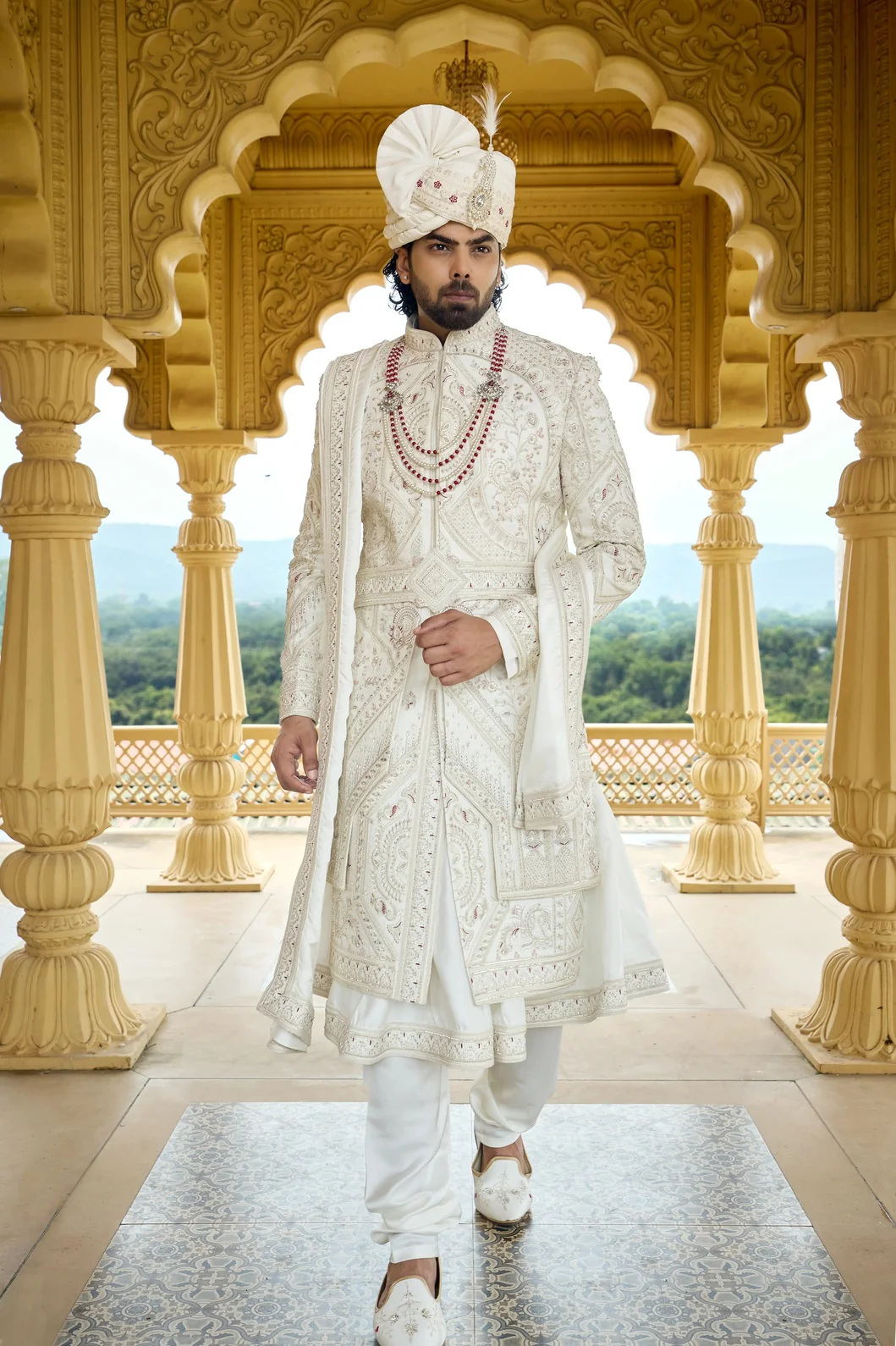 https://www.virasatbygopalsingh.com/uploads/team/1782984383_main_ivory-maharaja-wedding-sherwani-with-maroon-touch.webp